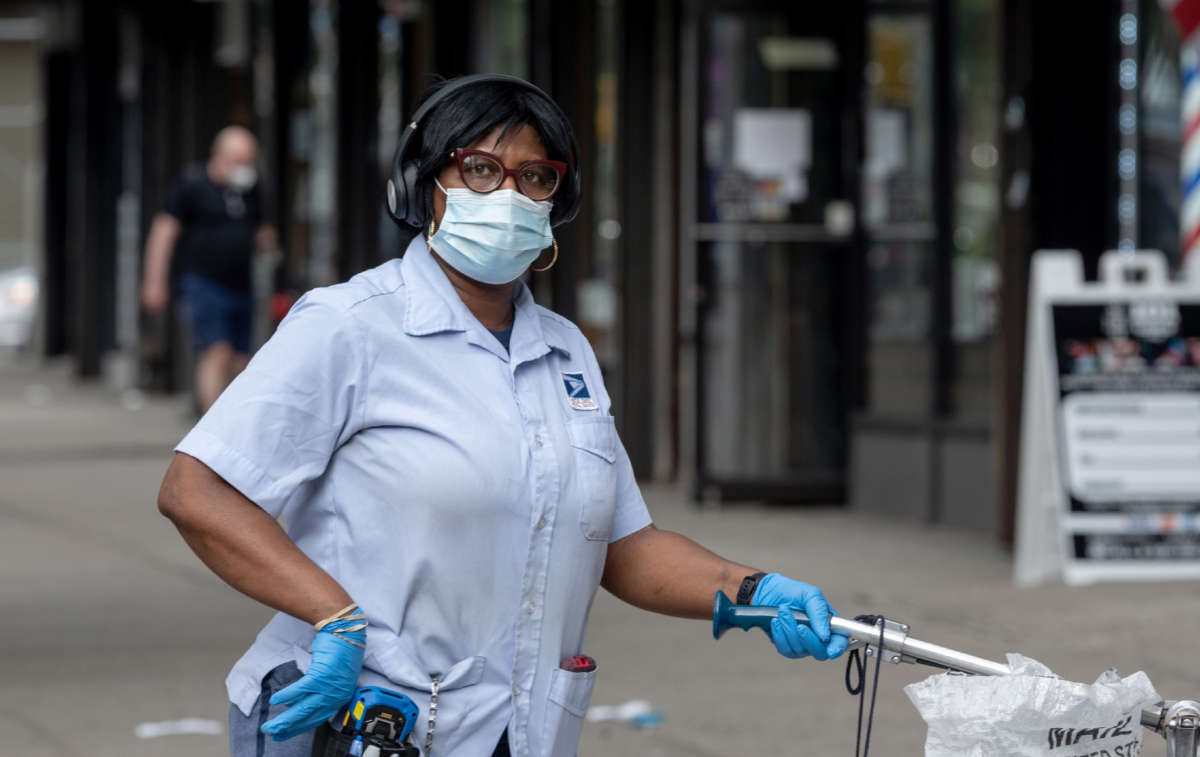 A USPS mail worker is seen on August 06, 2020, in New York City.