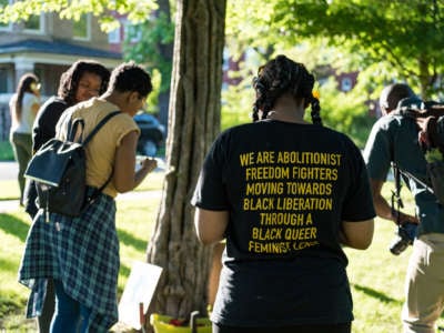 Participants take part in an event organized by Love & Protect to lift up the names and celebrate the lives of Black women and girls who have been killed by state violence at Rekia's Tree in Douglass Park, Chicago, on June 13, 2018.