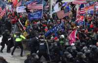 Trump loyalists clash with police and security forces as they push barricades to storm the U.S. Capitol in Washington, D.C., on January 6, 2021.