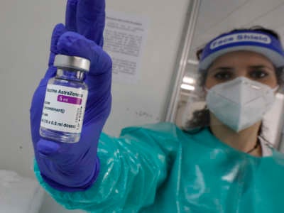 A nurse shows the AstraZeneca vaccine used at the "Covid Express" vaccination centre at Son Dureta Hospital in Palma, Spain, on February 27, 2021.