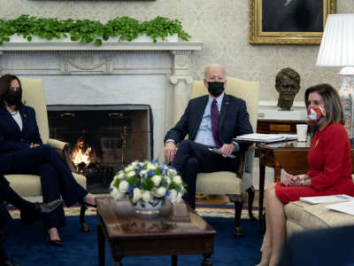 President Joe Biden and Vice President Kamala Harris meet with House Democratic leaders, including Speaker of the House Nancy Pelosi, and committee chairs to discuss the coronavirus relief legislation in the Oval Office at the White House February 5, 2021, in Washington, D.C.