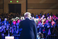 The back of Donald Trump's head is seen as he speaks to a crowd of supporters