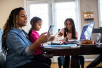 Family using internet at table