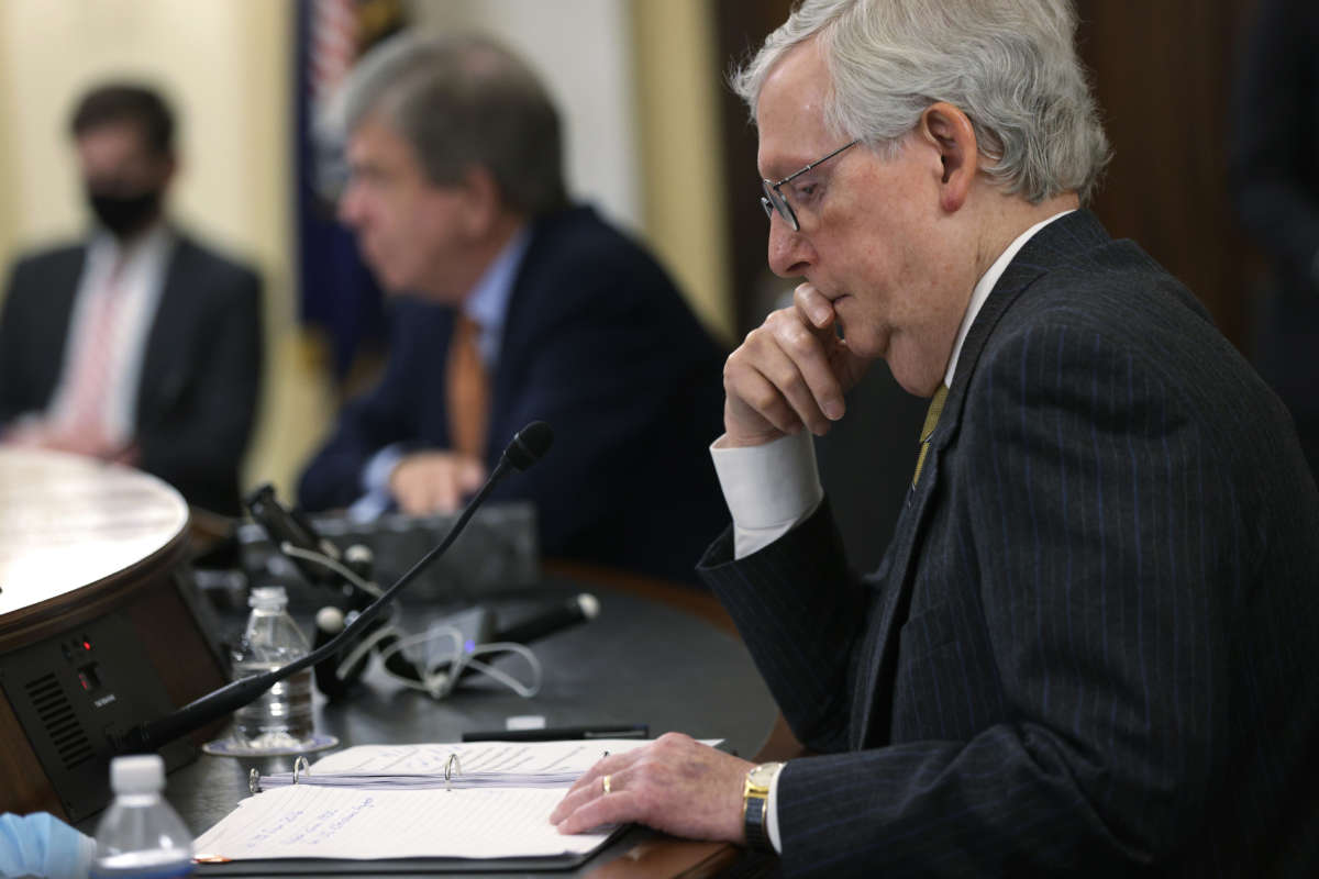 Senate Minority Leader Mitch McConnell listens during a Senate Rules and Administration Committee hearing on the For the People Act on March 24, 2021, in Washington, D.C.