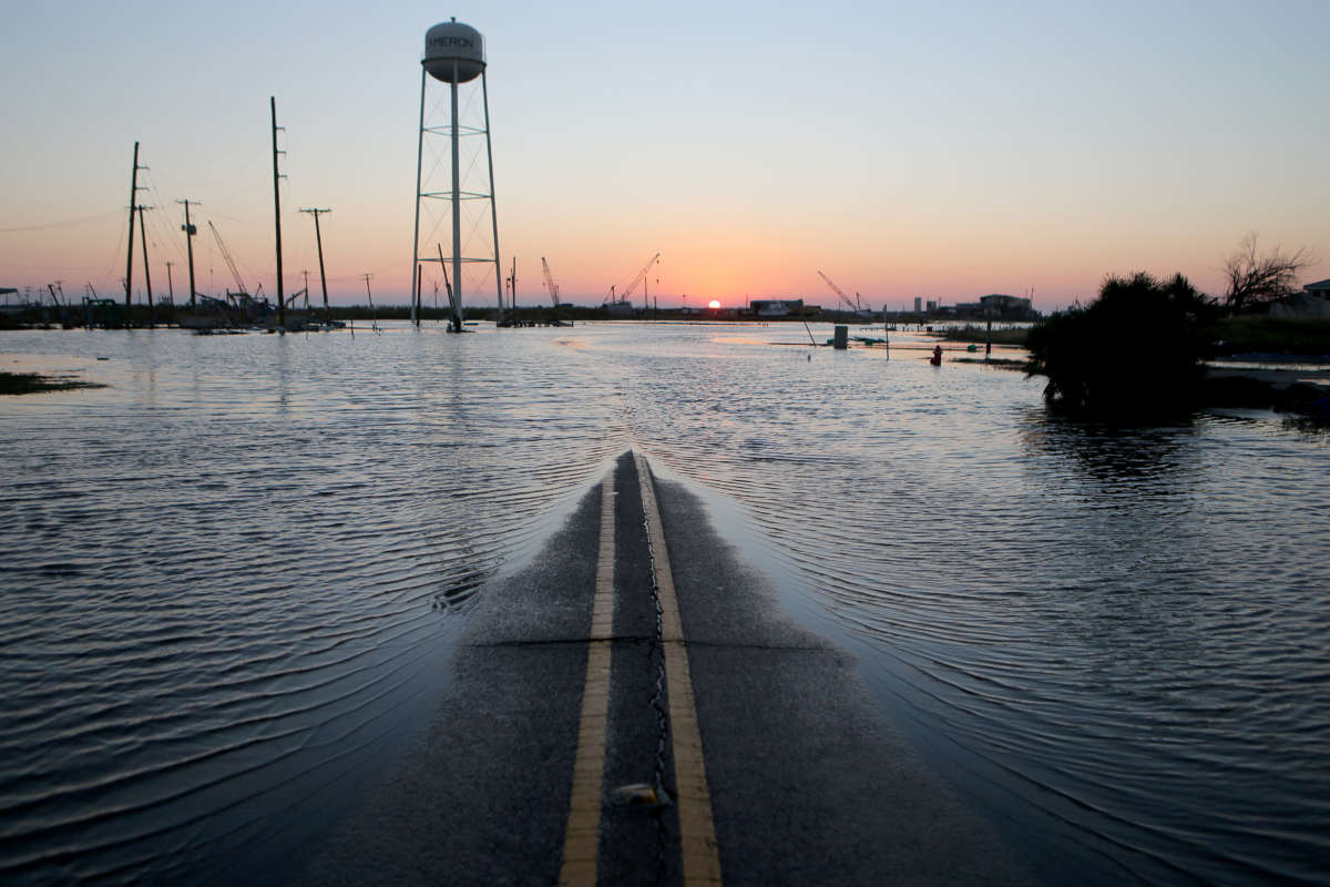 Flood waters cover a roadway near structures damaged by Hurricane Laura on October 10, 2020, in Cameron, Louisiana.