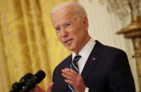 President Joe Biden talks to reporters during a news conference in the East Room of the White House on March 25, 2021, in Washington, D.C.