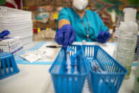 A nurse fills up a syringe with the Moderna COVID-19 vaccine at a vaccination site at a senior center on March 29, 2021, in San Antonio, Texas.