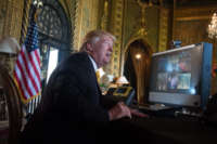 President Trump speaks to members of the U.S. military via video teleconference on Thanksgiving Day, November 23, 2017, from his residence in Mar-a-Lago in Florida.