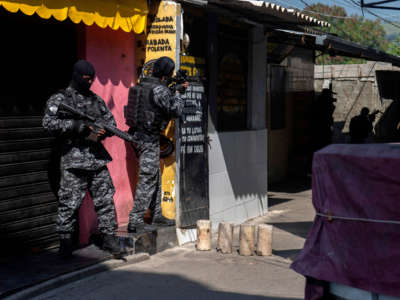 Civil Police officers take part in an operation against alleged drug traffickers at the Jacarezinho favela in Rio de Janeiro, Brazil, on May 6, 2021.