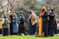 People attend the first Friday prayers of the Islamic holy month of Ramadan outside the Hennepin County Government Center in Minneapolis, Minnesota on April 16, 2021. Makram El-Amin called for justice for those that were lost to police violence in the Friday sermon.