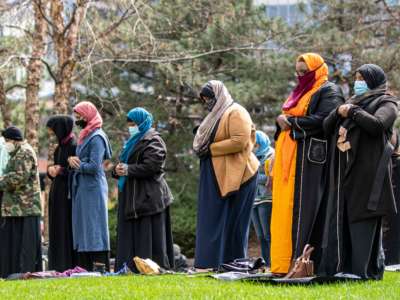 People attend the first Friday prayers of the Islamic holy month of Ramadan outside the Hennepin County Government Center in Minneapolis, Minnesota on April 16, 2021. Makram El-Amin called for justice for those that were lost to police violence in the Friday sermon.