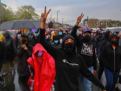Demonstrators march towards Boston Police Headquarter to protest the police-perpetrated killing of 16-year-old Ma'Khia Bryant who was shot by Columbus Police on April 21, 2021. This march was initially organized to celebrate the life of George Floyd following the verdict of Derek Chauvin.