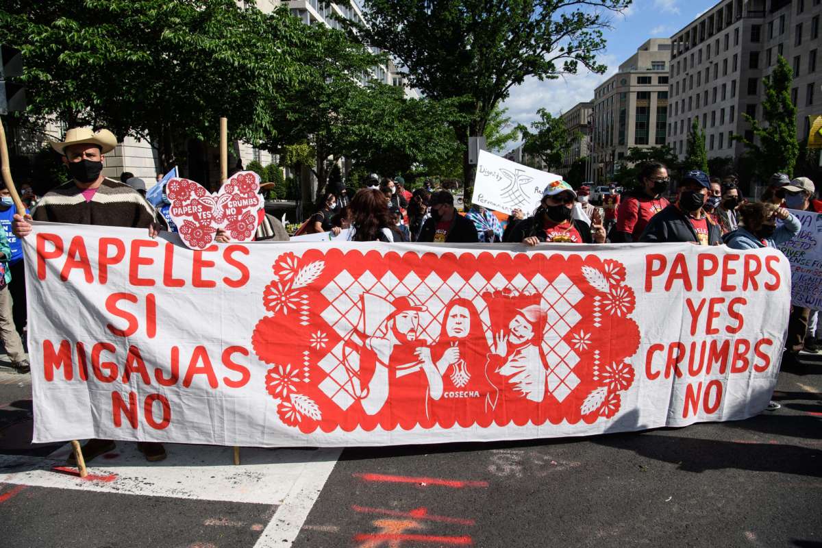 Activist from migrants organizations Cosecha (Harvest) and TPS Alliance protest near the White House on April 30 in Washington, DC, to demand more immigration action from the administration of US President Joe Biden.