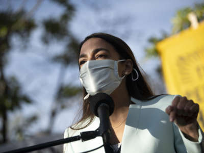 Rep. Alexandria Ocasio-Cortez (D-New York) speaks during a news conference to push then-President-elect Joe Biden to appoint a corporate-free cabinet outside of the Democratic National Headquarters in Washington on Thursday, Nov. 19, 2020.