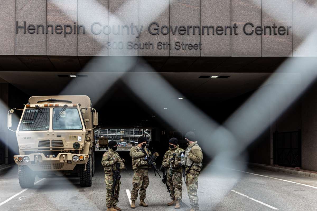 Members of the national guard stand outside the Hennepin County Government Center