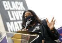 Rep. Cori Bush (D-Missouri) speaks at The National Council for Incarcerated Women and Girls "100 Women for 100 Women" rally in Black Lives Matter Plaza near The White House on March 12, 2021.