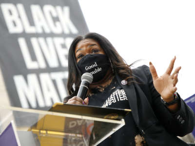 Rep. Cori Bush (D-Missouri) speaks at The National Council for Incarcerated Women and Girls "100 Women for 100 Women" rally in Black Lives Matter Plaza near The White House on March 12, 2021.