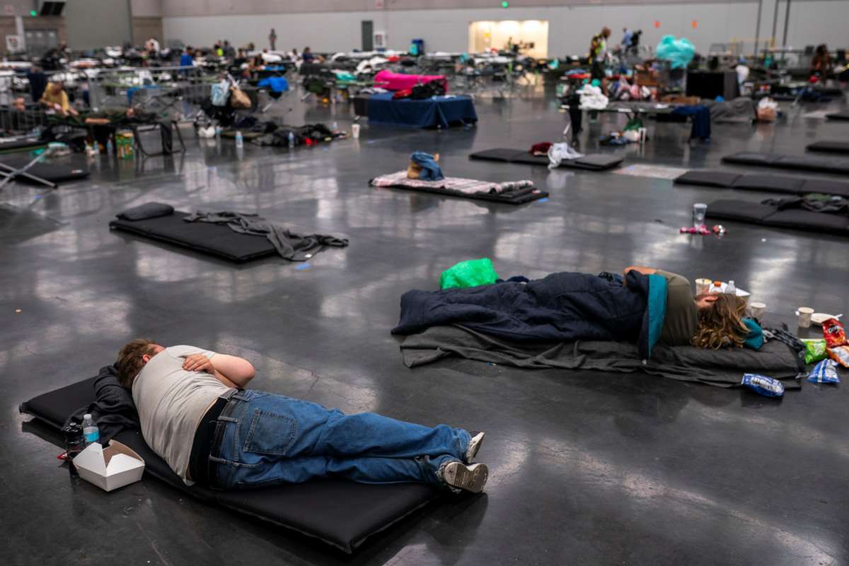 Portland residents fill a cooling center with a capacity of about 300 people at the Oregon Convention Center June 27, 2021 in Portland, Oregon. Record breaking temperatures lingered over the Northwest during a historic heat wave this weekend.