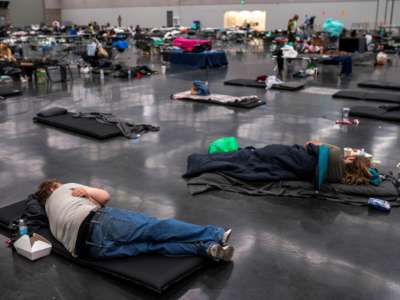Portland residents fill a cooling center with a capacity of about 300 people at the Oregon Convention Center June 27, 2021 in Portland, Oregon. Record breaking temperatures lingered over the Northwest during a historic heat wave this weekend.