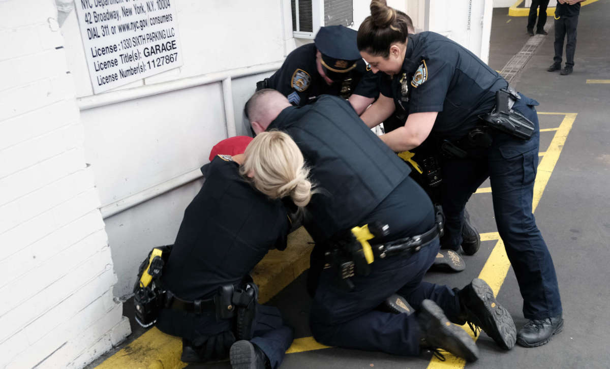 Police arrest a pro-Palestinian demonstrator at a rally against recent Israeli airstrikes on Gaza and repression of Palestinian protesters in Jerusalem on May 14, 2021, in New York City.