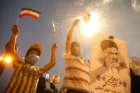 Ebrahim Raisi supporters celebrate after the Iranian presidential election results were announced on June 19, 2021, in Tehran, Iran.