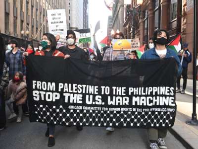 Activists from Filipino organizations march during a May 2021 Chicago rally in support of Palestine.