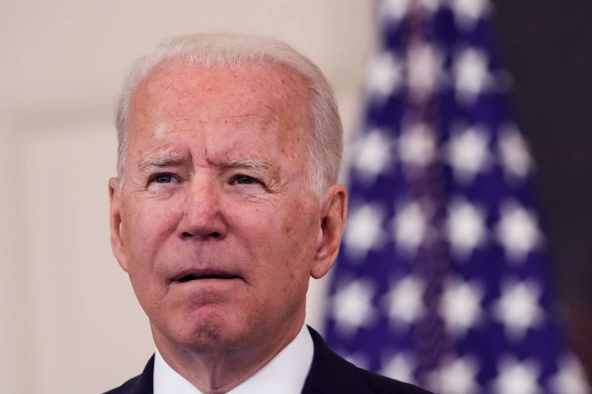 Joe Biden does something with his mouth to imply that he's in thought, but not particularly deeply
