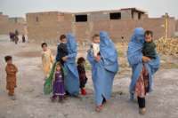 Members of an internally displaced Afghan family who left their home during the ongoing conflict between Taliban and Afghan security forces arrive from Qala i Naw to the Injil District of Herat on July 8, 2021.