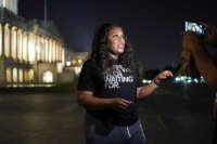 Rep. Cori Bush speaks with supporters as she spends the night outside the U.S. Capitol to call for for an extension of the federal eviction moratorium on July 31, 2021, in Washington, D.C.