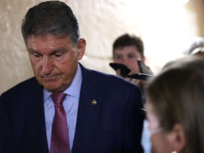 Sen. Joe Manchin talks to reporters as he leaves a meeting with members of Texas House Democratic Caucus at the U.S. Capitol on July 15, 2021, in Washington, D.C.