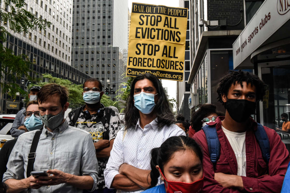 People participate in a protest against N.Y. Governor Andrew Cuomo and protest for a moratorium on evictions on August 4, 2021 in New York City.