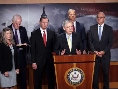 Senate Minority Leader Mitch McConnell (R-Kentucky), joined by fellow Republican Senators, speaks on a proposed Democratic tax plan during a press conference at the U.S. Capitol on August 04, 2021 in Washington, DC.