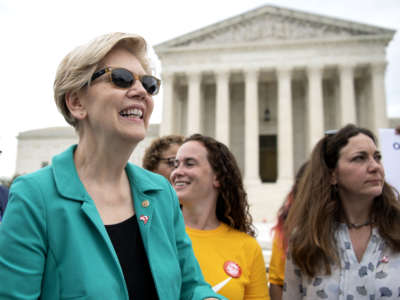 Sen. Elizabeth Warren (D-Massachusetts) attends a rally, hosted by the Declaration for American Democracy coalition, calling on the Senate to pass the For the People Act, outside the Supreme Court in Washington on Wednesday, June 9, 2021.