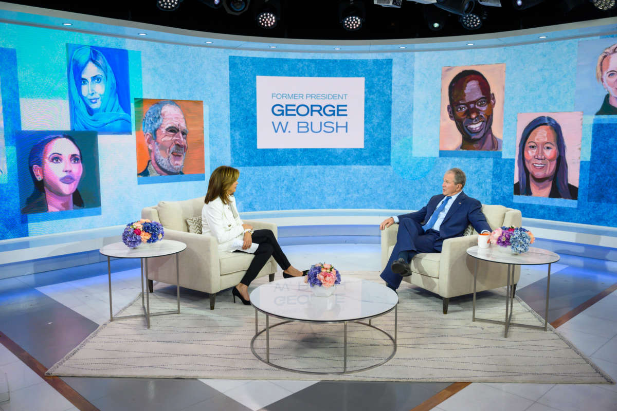 George W. Bush is interviewed while surrounded by his "paintings"