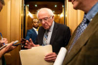 Sen. Bernie Sanders (I-Vermont) speaks with reporters in the Senate side of the U.S. Capitol Building on Wednesday, July 21, 2021.