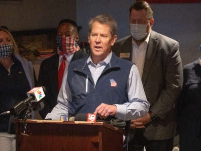 Georgia Gov. Brian Kemp speaks at a news conference about the state's new voter suppression law at AJ’s Famous Seafood and Poboys on April 10, 2021, in Marietta, Georgia.