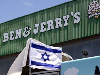 An Israeli flag is set atop a delivery truck outside U.S. ice-cream maker Ben and Jerry's factory in Be'er Tuvia, Israel, on July 21, 2021.