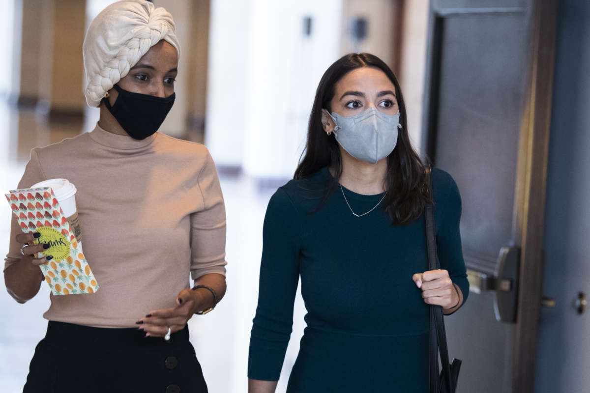 Representatives Alexandria Ocasio-Cortez and Ilhan Omar are seen in the Capitol Visitor Center after a briefing by administration leaders on the U.S. withdrawal from Afghanistan on August 24, 2021.