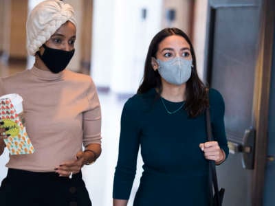 Representatives Alexandria Ocasio-Cortez and Ilhan Omar are seen in the Capitol Visitor Center after a briefing by administration leaders on the U.S. withdrawal from Afghanistan on August 24, 2021.