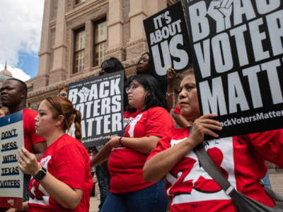Demonstrators are gathered outside of the Texas State Capitol during a voting rights rally on the first day of the 87th Legislature's special session on July 8, 2021 in Austin, Texas.