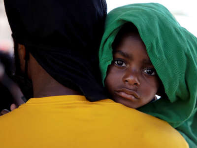 A father holds his baby