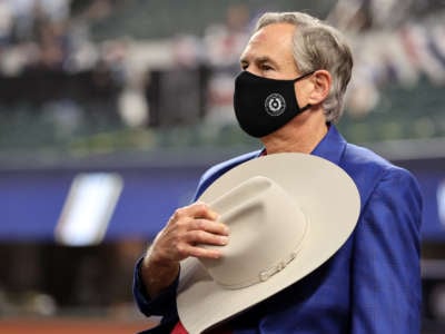 Texas Governor Greg Abbott is seen on field before Game 1 of the 2020 World Series between the Los Angeles Dodgers and the Tampa Bay Rays at Globe Life Field on October 20, 2020, in Arlington, Texas.