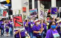 More than 1,000 janitors with the Service Employees International Union (SEIU) rally and march as their contracts expire ahead of a potential strike on September 1, 2021, in Los Angeles, California.