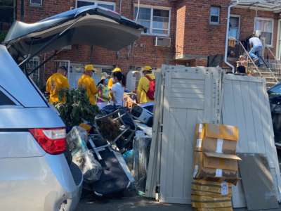 Volunteers help victims of flooding from Hurricane Ida in the Flushing neighborhood in Queens, New York.