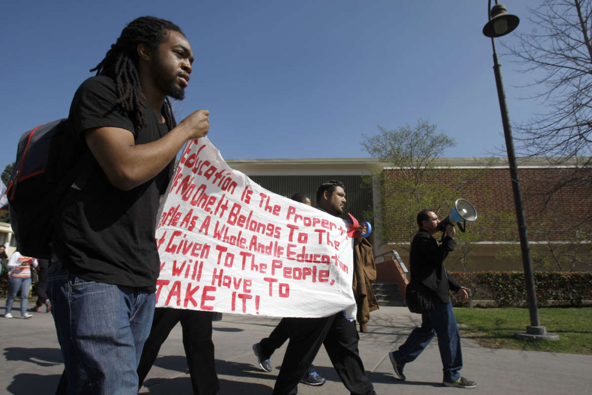 Ljazz Brooks, a third-year international business student, walks with other students in protest at California State University Los Angeles (CSULA) on February 25, 2014. He is part of the CSULA Ethnic Studies Coalition, a collective of students, educators, workers and activists demanding that at least one of the two diversity courses required to graduate from CSULA come from ethnic studies.