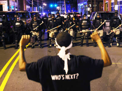 Police in riot gear force people off a street as they protest the killing of Andrew Brown Jr. on April 27, 2021, in Elizabeth City, North Carolina.