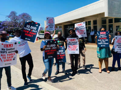 Demonstrators rally at the U.S. Embassy in South Africa on October 12, 2021.