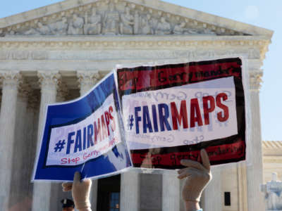People gather outside the Supreme Court as gerrymandering cases are heard on March 26, 2019.