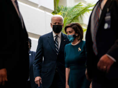 President Joe Biden and Speaker of the House Nancy Pelosi depart a House Democratic Caucus meeting in the U.S. Capitol on October 28, 2021, in Washington, D.C.