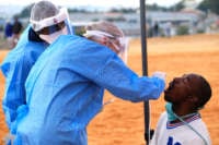 Health workers conduct swabs during intensified testing and screening on Freedom Day on April 27, 2020, in Alexandra, Gauteng, in South Africa.